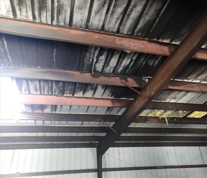 Picture of a maintenance shed with smoke damaged steel