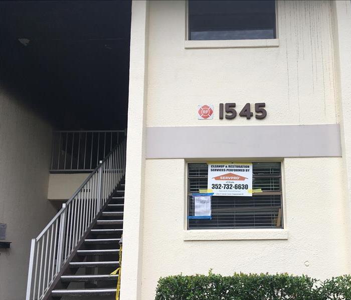 SERVPRO of Ocala Cleaning and Restoration sign placed on outside of fire damaged building